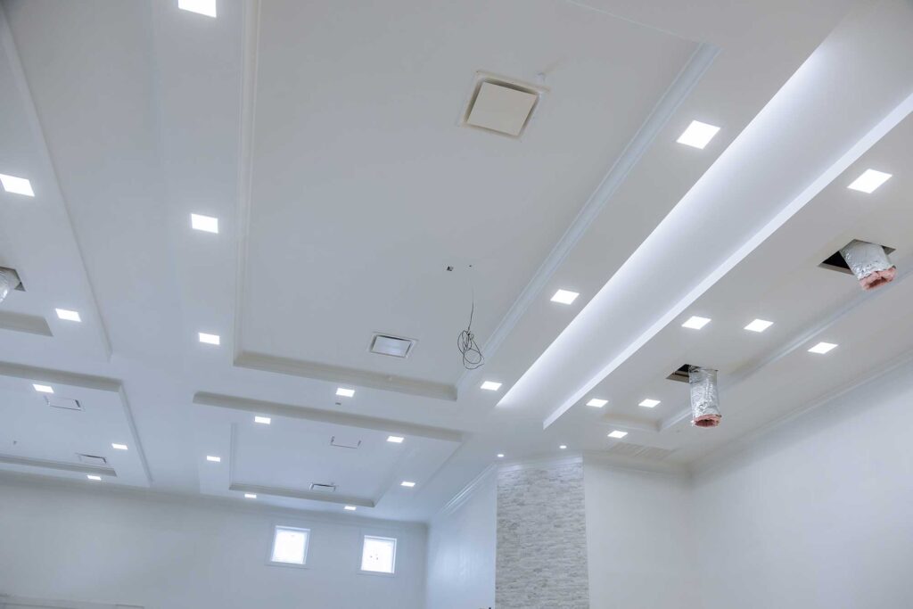 A large room with bright white walls and ceiling lights