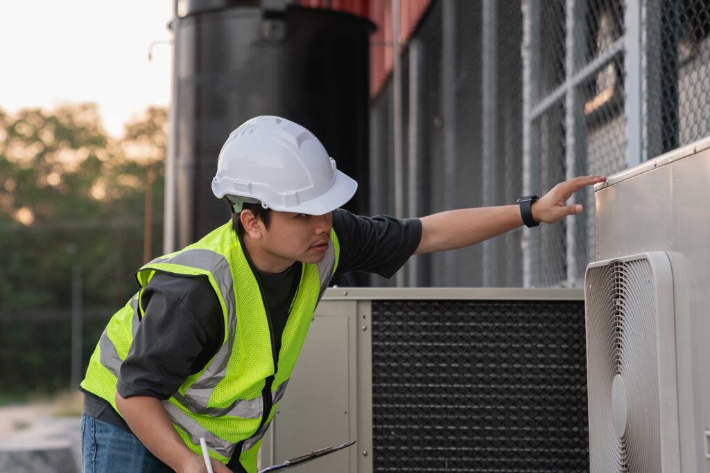 An engineer are inspecting the cooling system