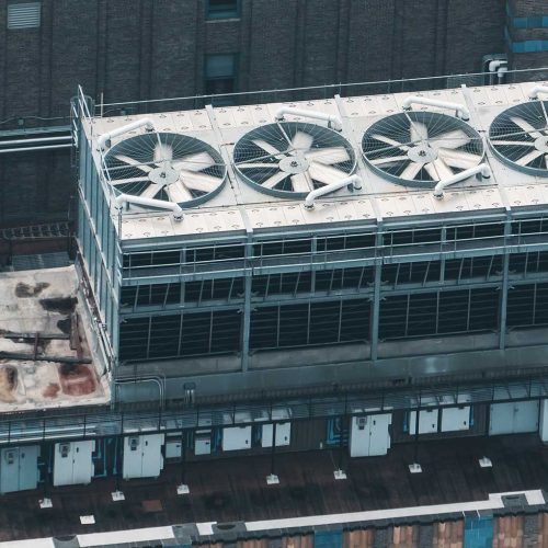 A large industrial building with a large cooling system